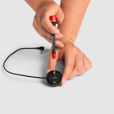 This is a picture of someone adjusting the dipswitch in the Twister Pro